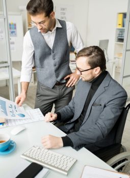 Business people examining business graphs